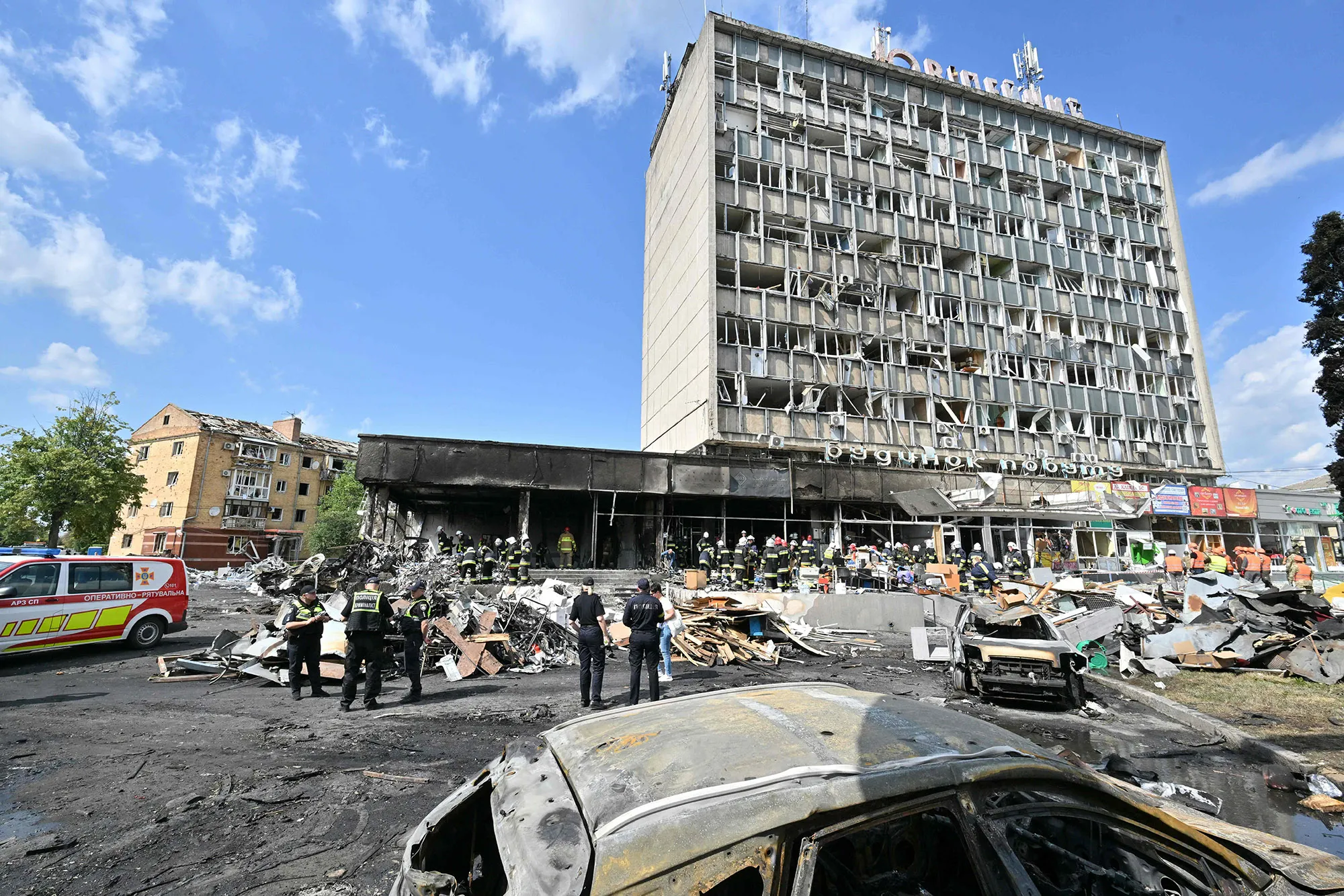 Firefighters inspect a damaged building following a Russian airstrike in the city of Vinnytsia, Ukraine, on July 14.