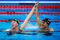 Lilly King (L) of the United States celebrates winning gold with Katie Meili (R) of the United States in the Women's 100m Breaststroke Final on Day 3 of the Rio 2016 Olympic Games.
