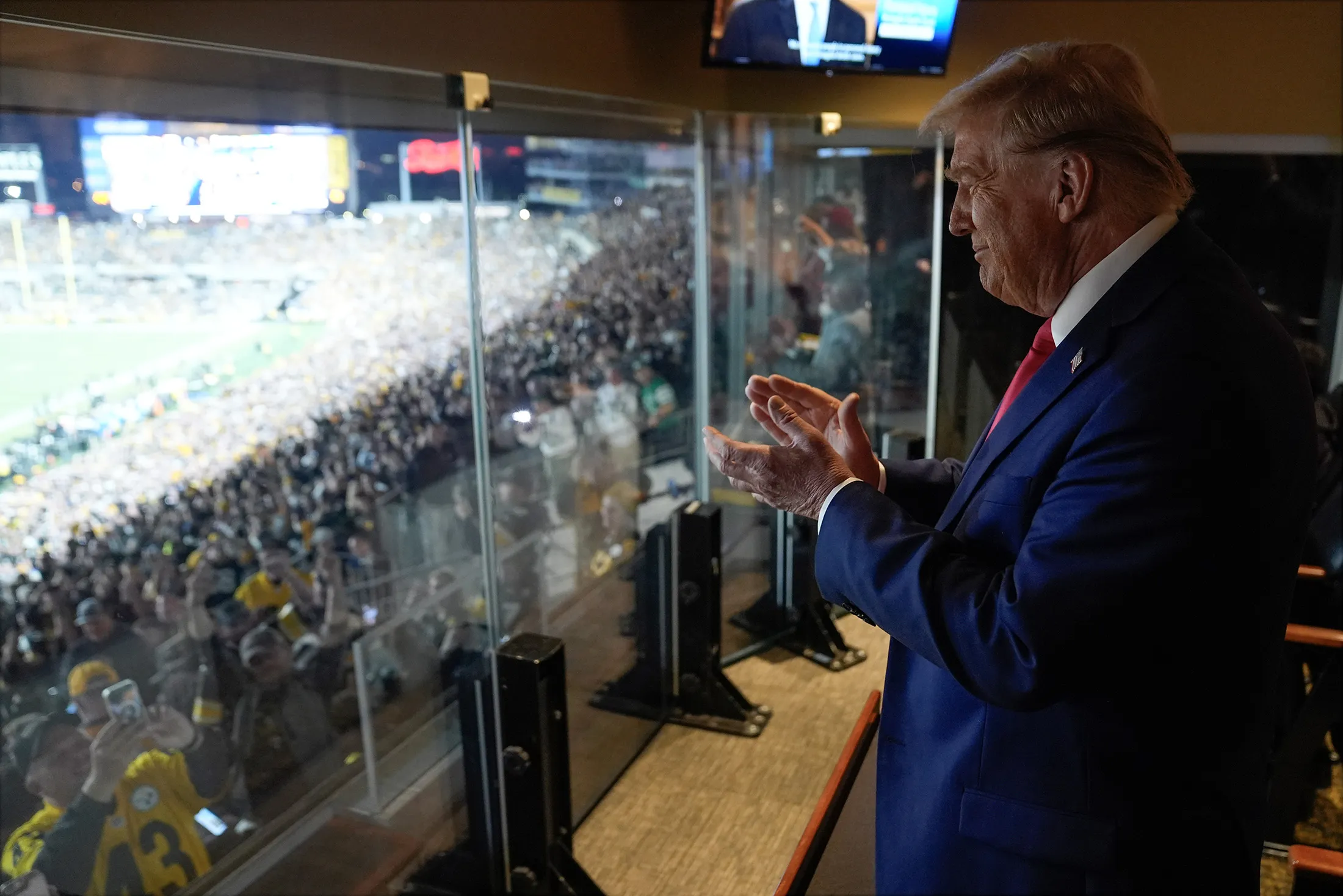 Donald Trump attending a game between the NFL Pittsburgh Steelers and the New York Jets in Latrobe, Pennsylvania.