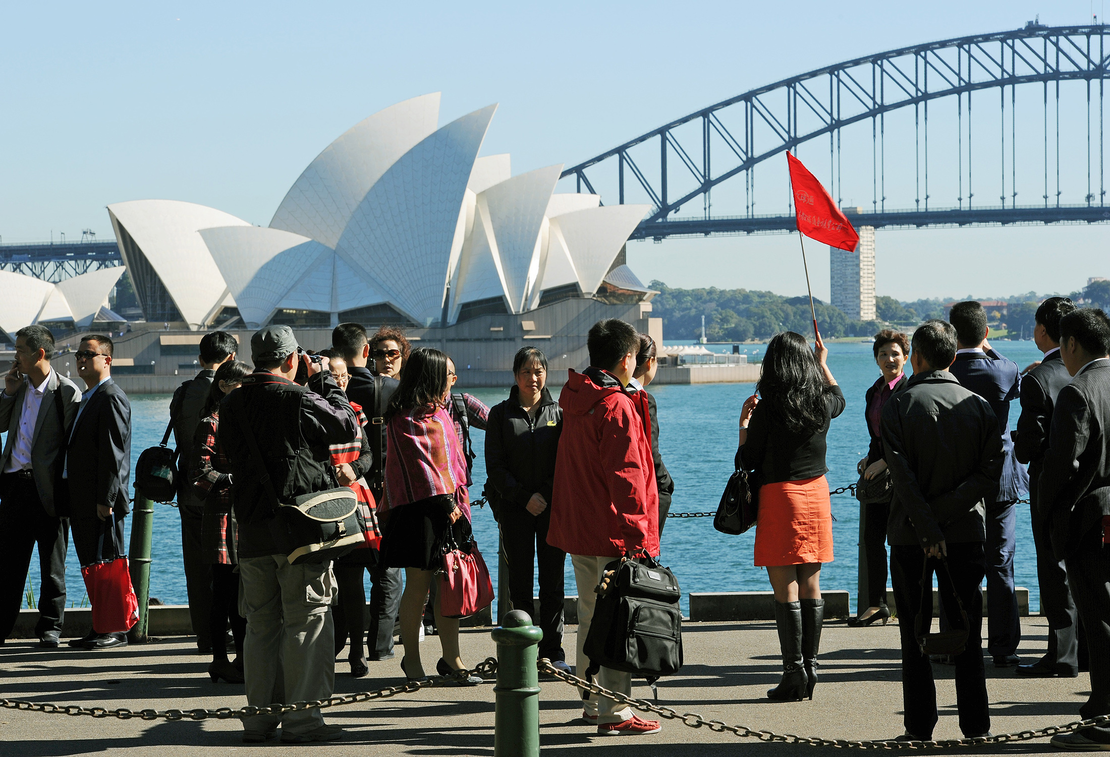 A group of Asian tourists arrive to have