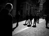 Pedestrians walk past the New York Stock Exchange.