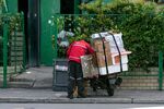 A delivery worker for JD.com Inc. sorts parcels in Shanghai, China, on Friday, April 4, 2025. De minimis tariff exemptions, which currently allow packages worth as much as $800 from China and Hong Kong to enter the US duty free, will end on May 2.