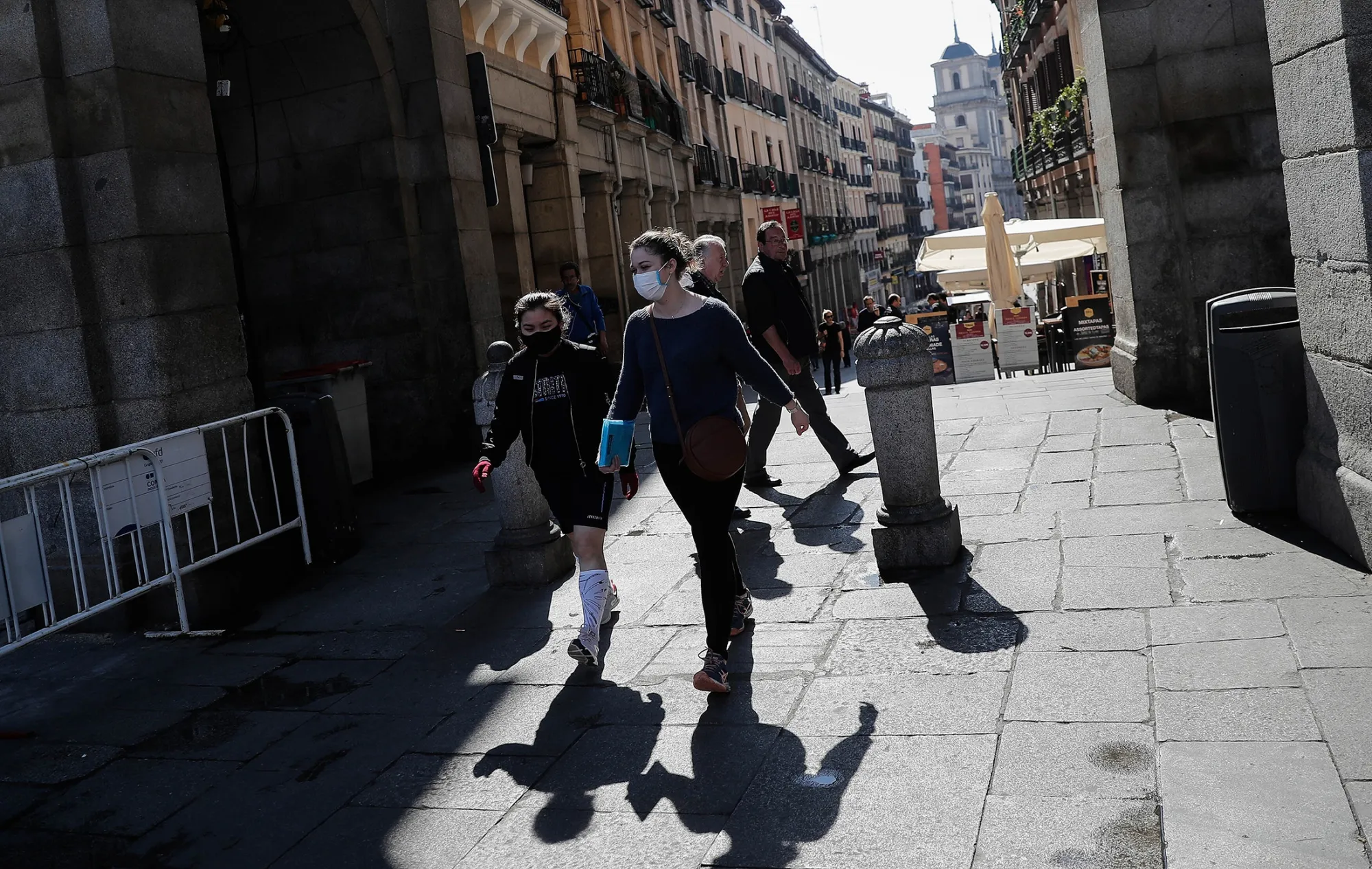 Pedestrians pass through Plaza Mayor in Madrid, on March 13.