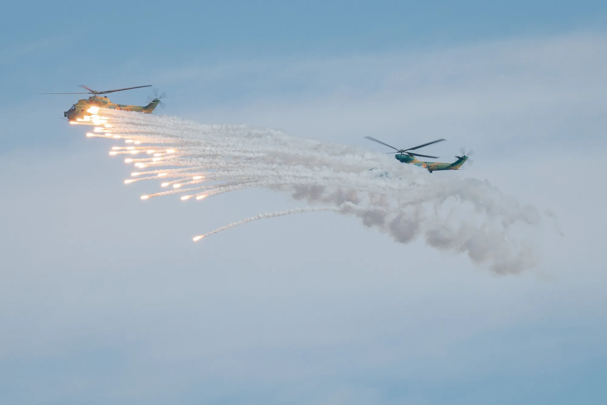 Helicopters operate during a NATO military exercise in Cincu, Romania.