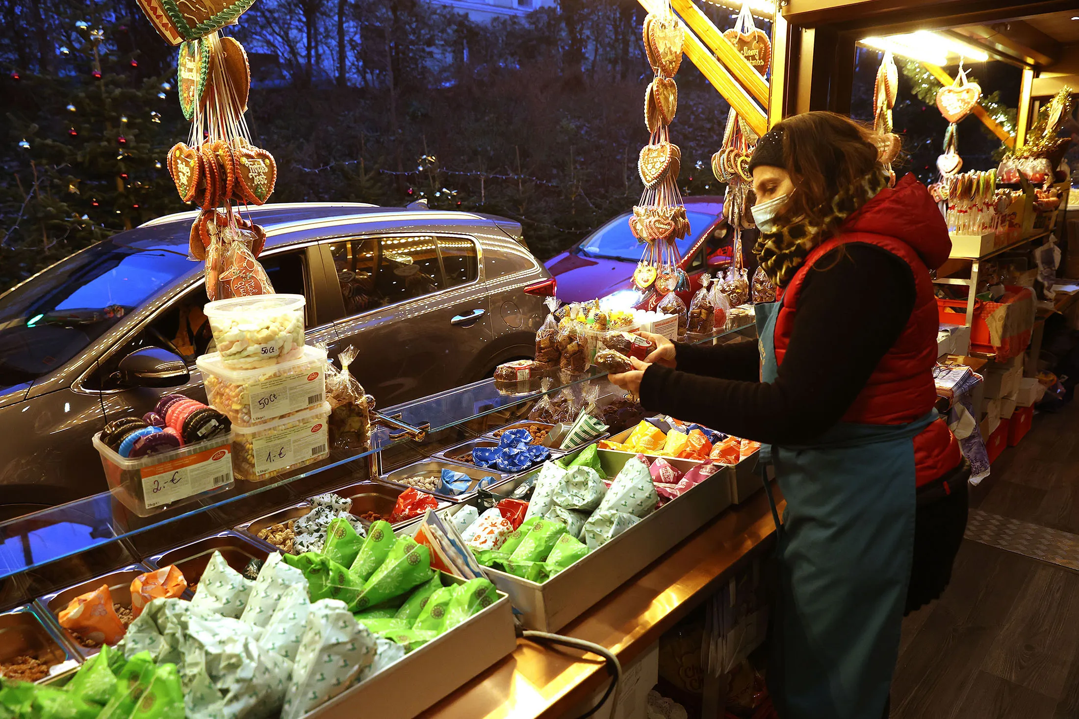 Customers in their cars receive&nbsp;goods at a drive-in Christmas market in Landshut, Germany, on Nov.&nbsp;26.