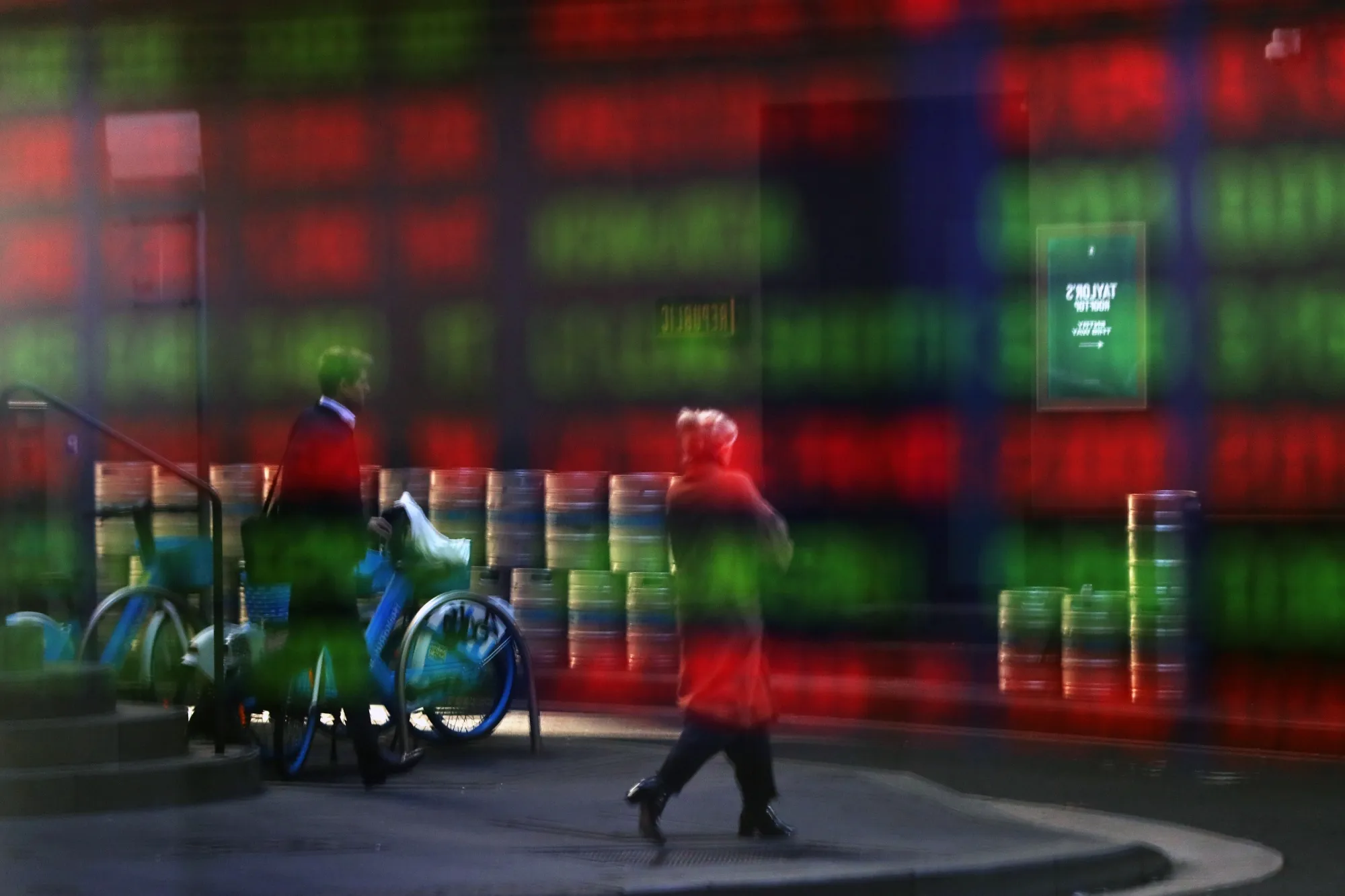 Stock information reflected in a window at the Australian Securities Exchange (ASX) in Sydney, Australia, on Tuesday, Aug. 12, 2025. 