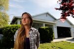 Whitney Hurst stands in front of the house that she rents from Invitation Homes in Esparto, California, in 2018. The percentage of single-family homes that are rented rather than owner-occupied has been growing since the recession.