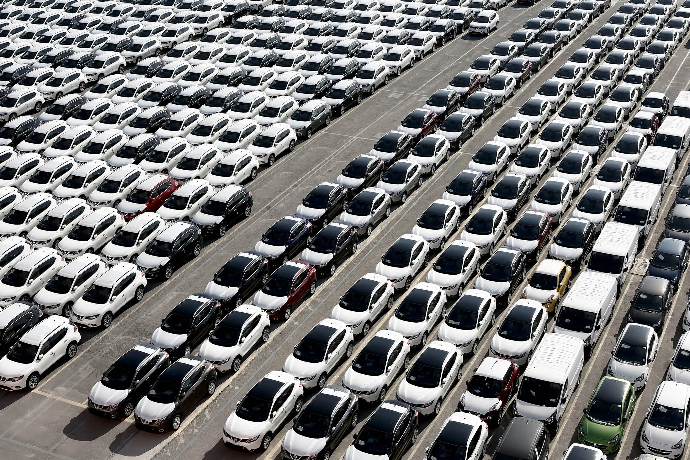 Nissan vehicles sit at the car terminal in the Port of Piraeus in Greece.
