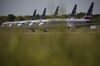 American Airlines Group Inc. Boeing Co. 737 Max planes sit parked outside of a maintenance hangar at Tulsa International Airport (TUL) in Tulsa, Oklahoma, U.S., on Tuesday, May 14, 2019. Three unions representing aviation safety inspectors said in a sharply worded report months before the Boeing's 737 Max was approved for use that the planemaker was given too much authority to oversee itself and that the new jet had safety flaws.