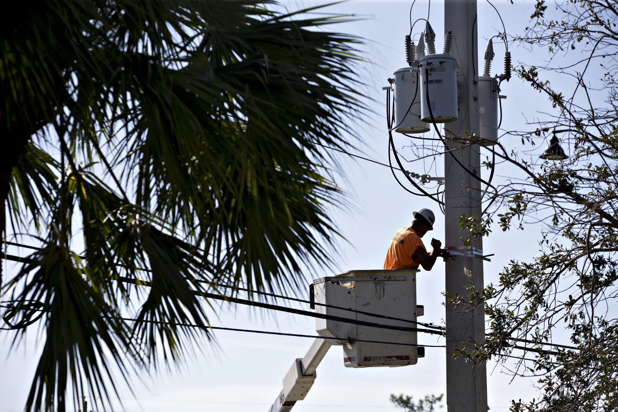 A lineman works on a utility pole as electricity is restored after Hurricane Irma in Fort Myers, Florida, on&nbsp;Sept. 13.