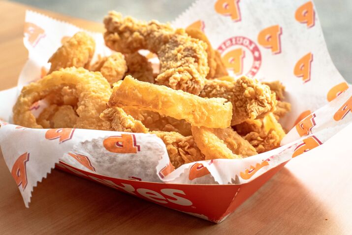 Popeyes real food: five chicken tenders with onion rings.