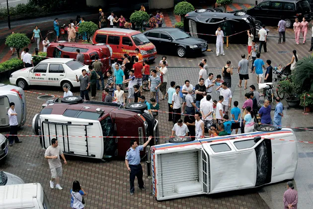 Overturned Japanese cars after a protest in China on Aug. 19