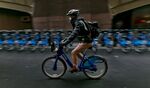 A relatively rare sight: A properly helmeted CitiBiker cycling through Manhattan
