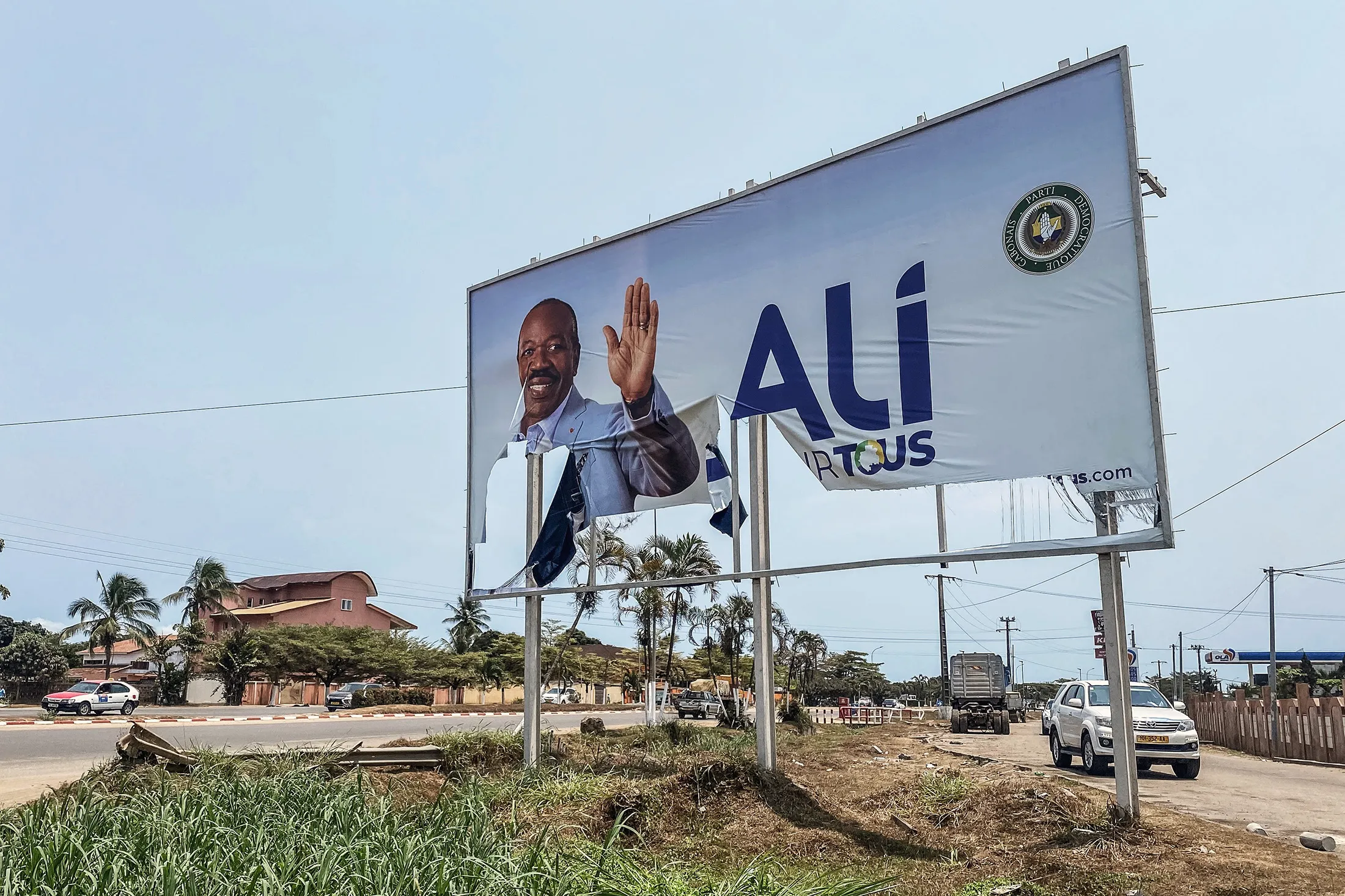 A torn campaign billboard of ousted Gabon President Ali Bongo in Libreville, on Aug. 31.