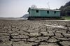 Cracked bed of the Aleixo Lake affected by a drought, near Manaus, Brazil.