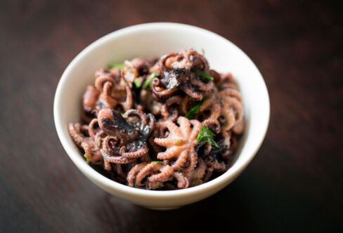 The Cafe Murano starter of baby octopus comes in a bowl with red pepper and cucumber.