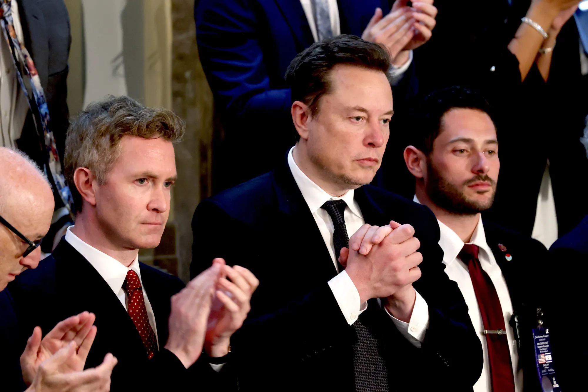 X owner and Tesla CEO Elon Musk, middle.