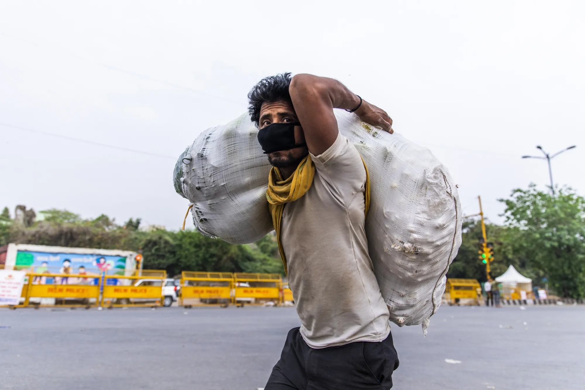 A man&nbsp;carries a sack of vegetables at a wholesale market&nbsp;in New Delhi on April 15.
