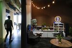 A Bitcoin neon sign is displayed in a lounge area at the Coinbase Inc. office in San Francisco, California, U.S.