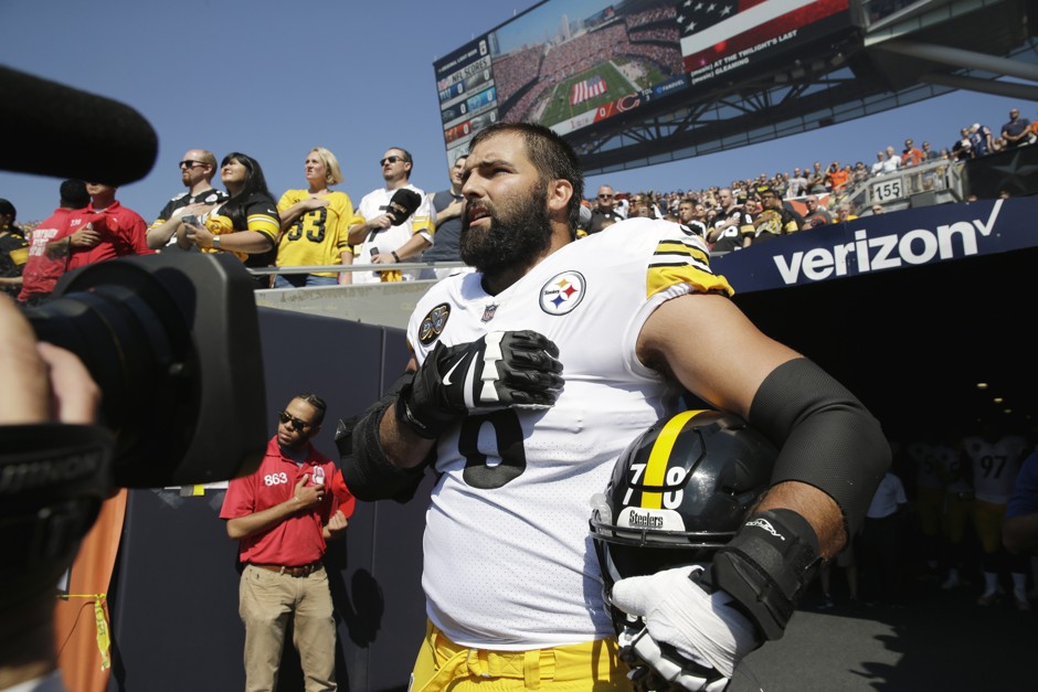 Pittsburgh Steelers offensive tackle and former Army Ranger Alejandro Villanueva stands outside the tunnel alone during the national anthem before an NFL football game against the Chicago Bears on Sunday. 