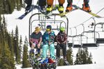 A skier wearing shorts and a t-shirt rides the chair lift at Arapahoe Basin Ski Area on May 25, 2019 in Dillon, Colorado.