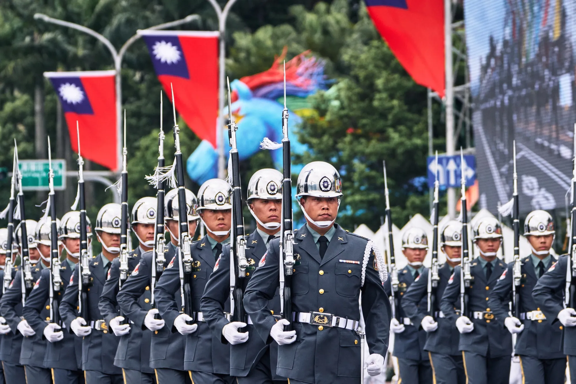 An honor guard march during the inauguration ceremony of Taiwan&nbsp;President Lai Ching-te in Taipei on May 20. Lai urged China to stop its intimidation of the democratic island. China this week did the opposite.
