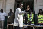 Jose Mario Vaz waves before casting his vote at a polling station in Bissau, on Nov. 24.