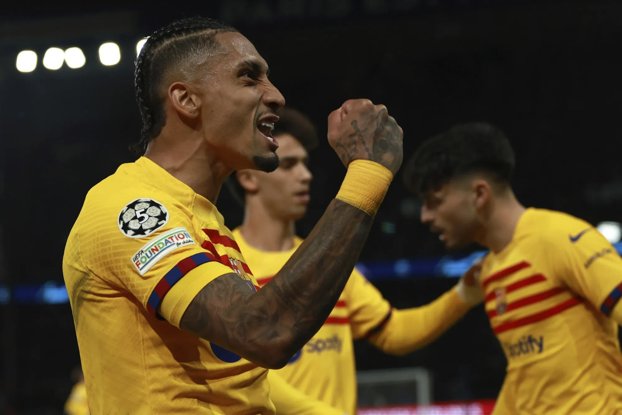 Barcelona's Raphinha celebrates scoring his side's second goal during the Champions League quarterfinal first leg soccer match between Paris Saint-Germain and Barcelona at the Parc des Princes stadium in Paris, Wednesday, April 10, 2024. (AP Photo/Aurelien Morissard)