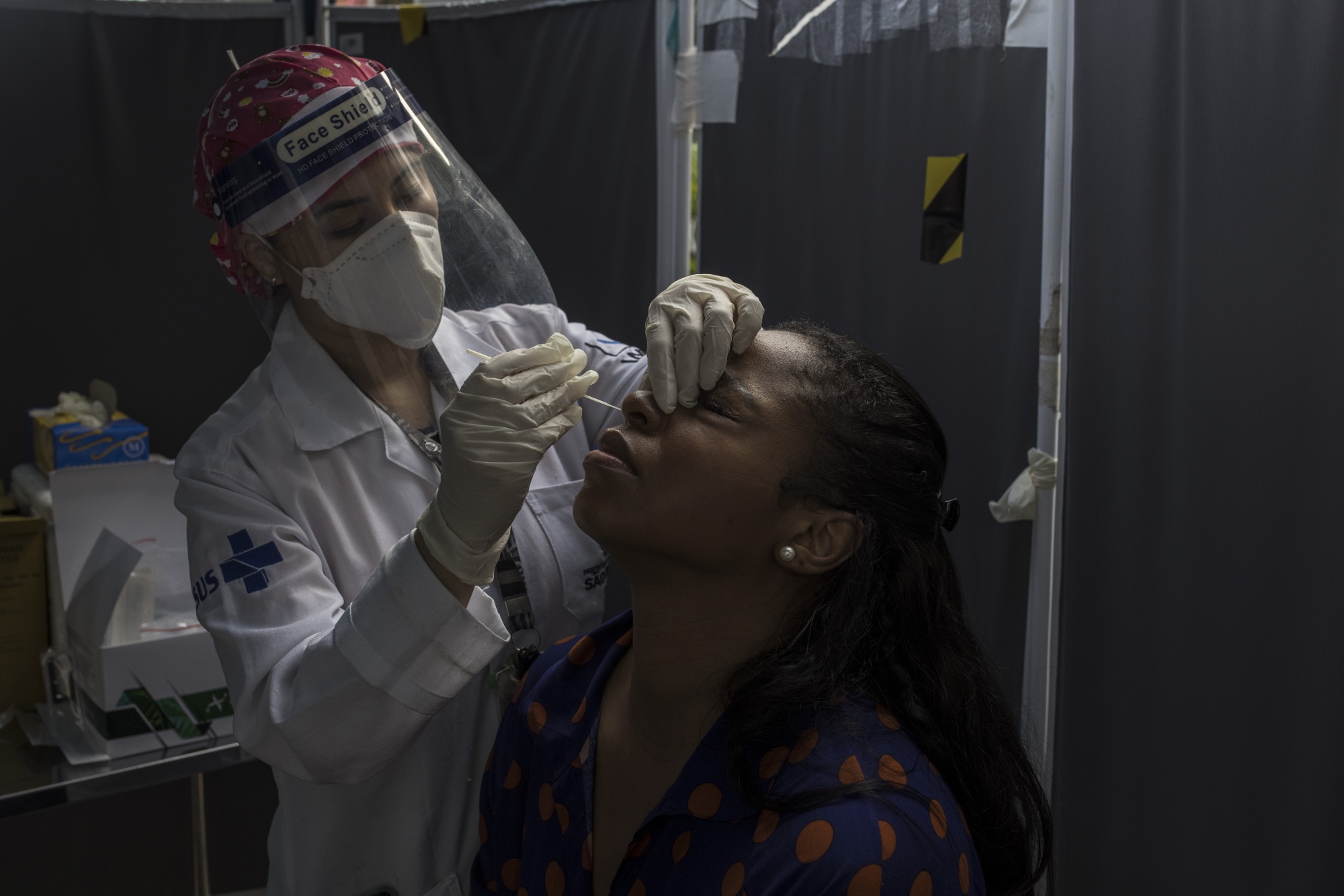 A health worker administers&nbsp;a Covid-19 swab test&nbsp;in Sao Paulo on Jan. 14.