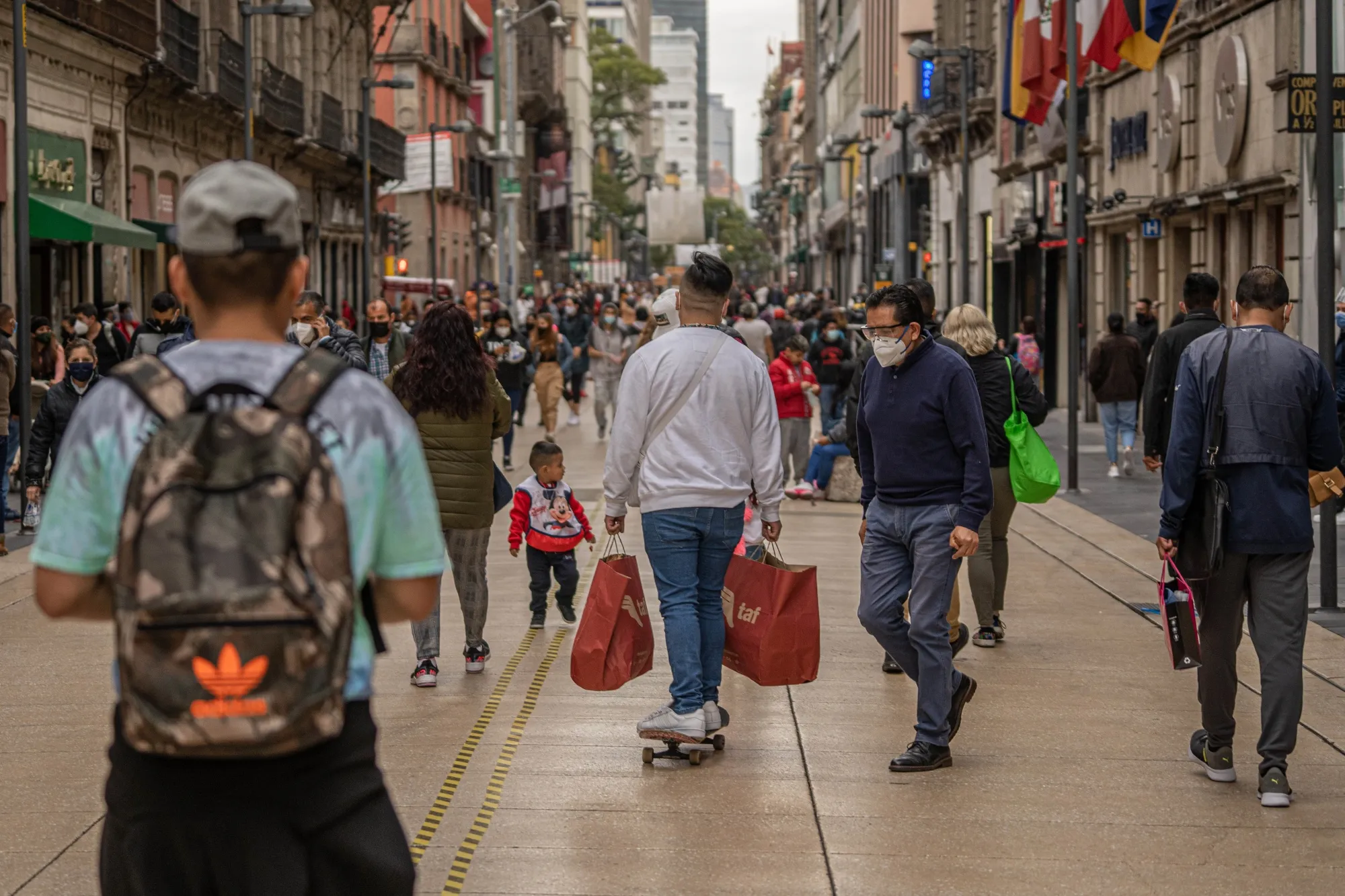 A skateboarder carrying shopping bags in Mexico City, Nov. 18.