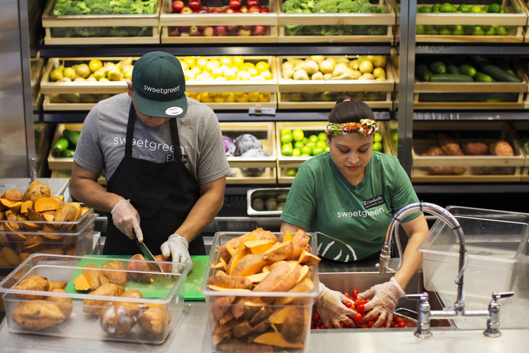 Workers prep&nbsp;inside a Sweetgreen Inc. restaurant in Boston.