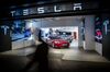 Electric automobiles are displayed inside a Tesla store in Barcelona.