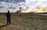 Residents watch a wildfire burning near Las Vegas, New Mexico, on May 3.