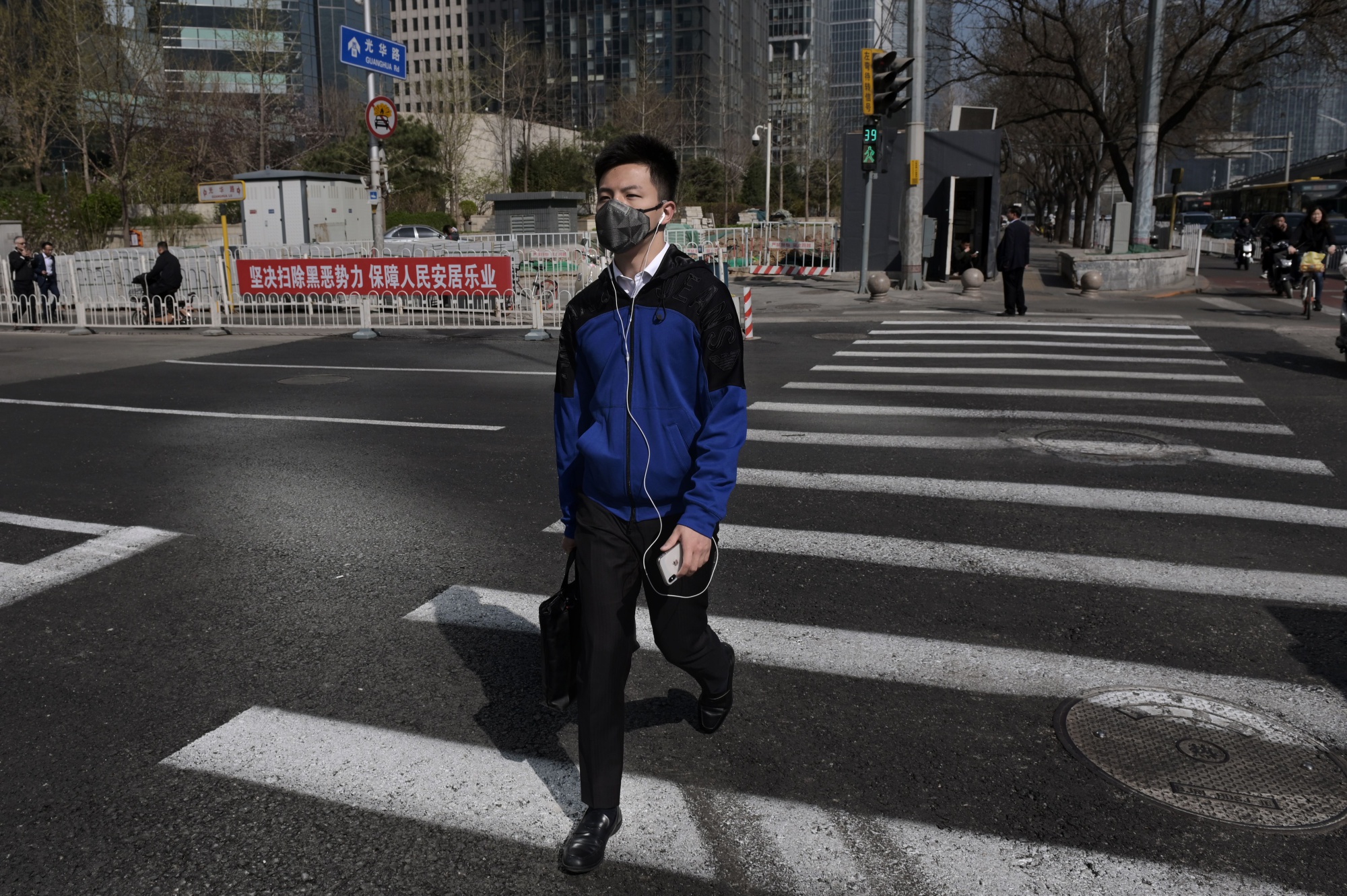 A man wears a protective mask to reduce the effects of air pollution in Beijing, March 2019.