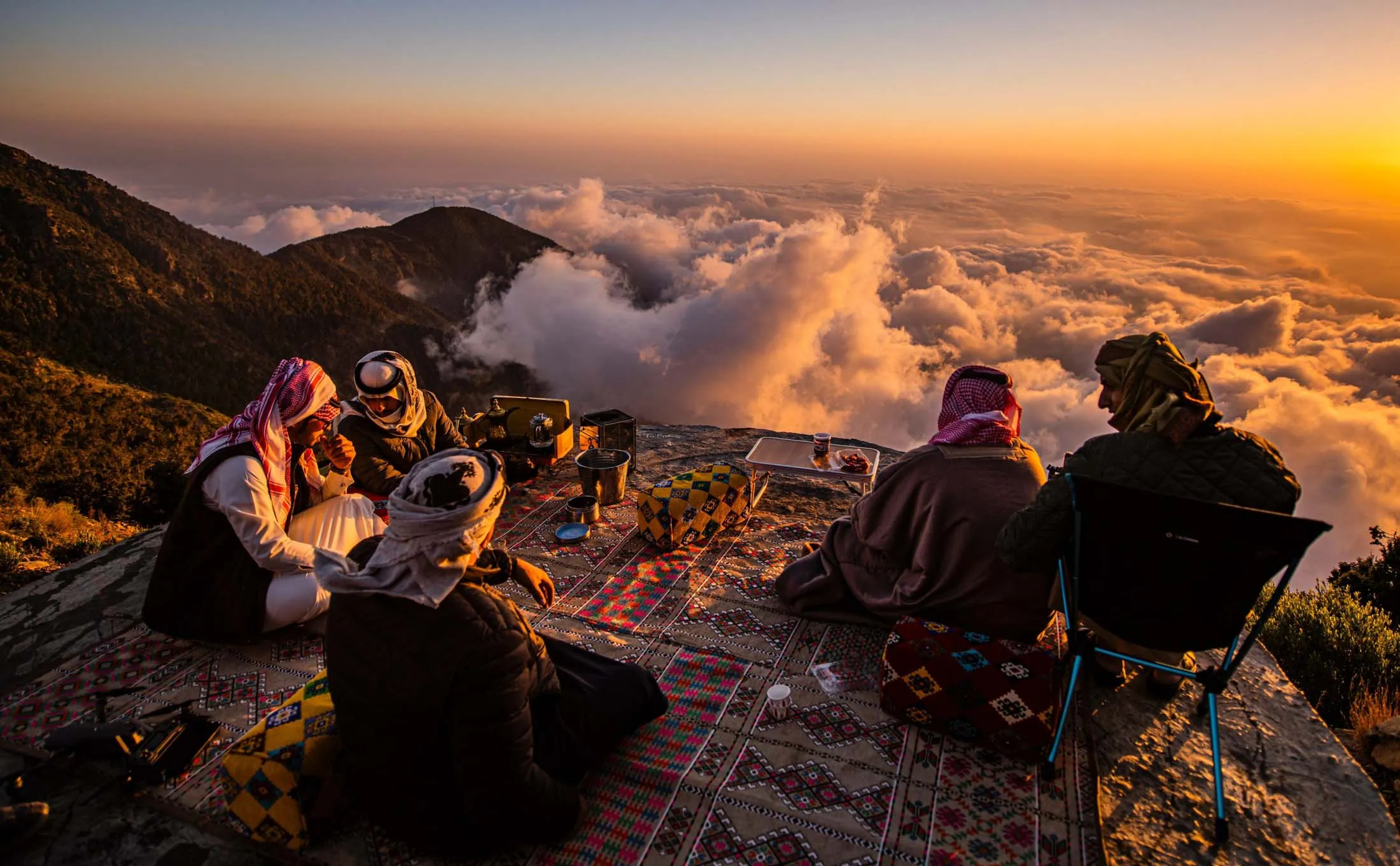 Locals sit among the mountain tops in Saudi Arabia’s southwestern province of Aseer. The region is known for its misty skies, with the nearby Red Sea generating moist air that pushes into the Sarawat Mountain range, and includes 20 of the highest peaks in the kingdom.