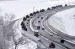 A convoy of Russian armored vehicles moves along a highway in Crimea on Jan. 18. 