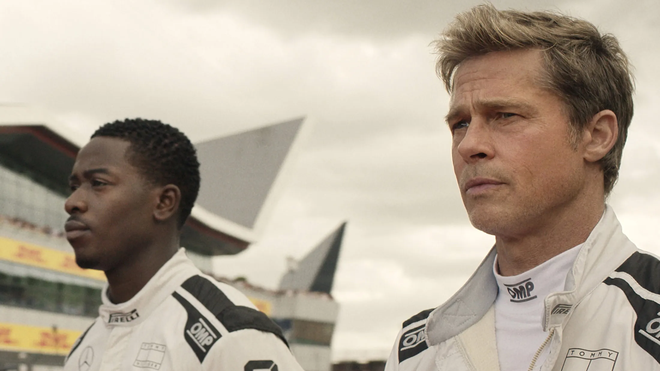 Damson Idris as Joshua Pearce and Brad Pitt as Sonny Hayes in F1.