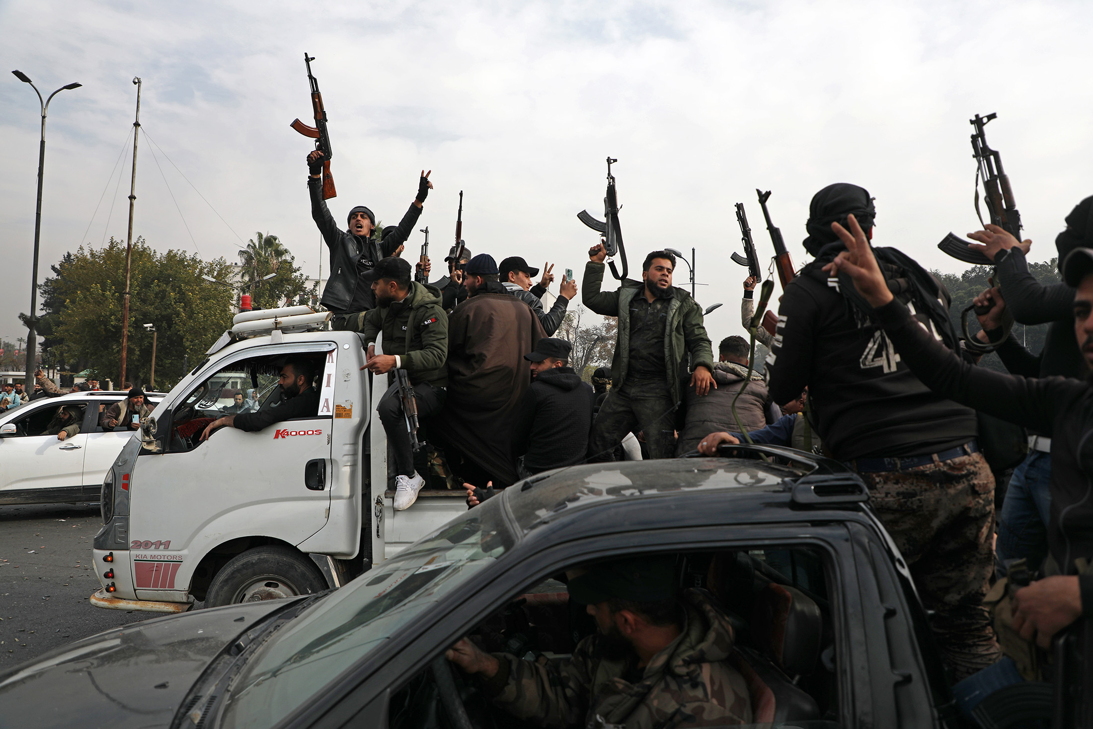 People celebrate the fall of the Syrian regime at Umayyad Square in Damascus, Syria on Dec. 8, 2024.