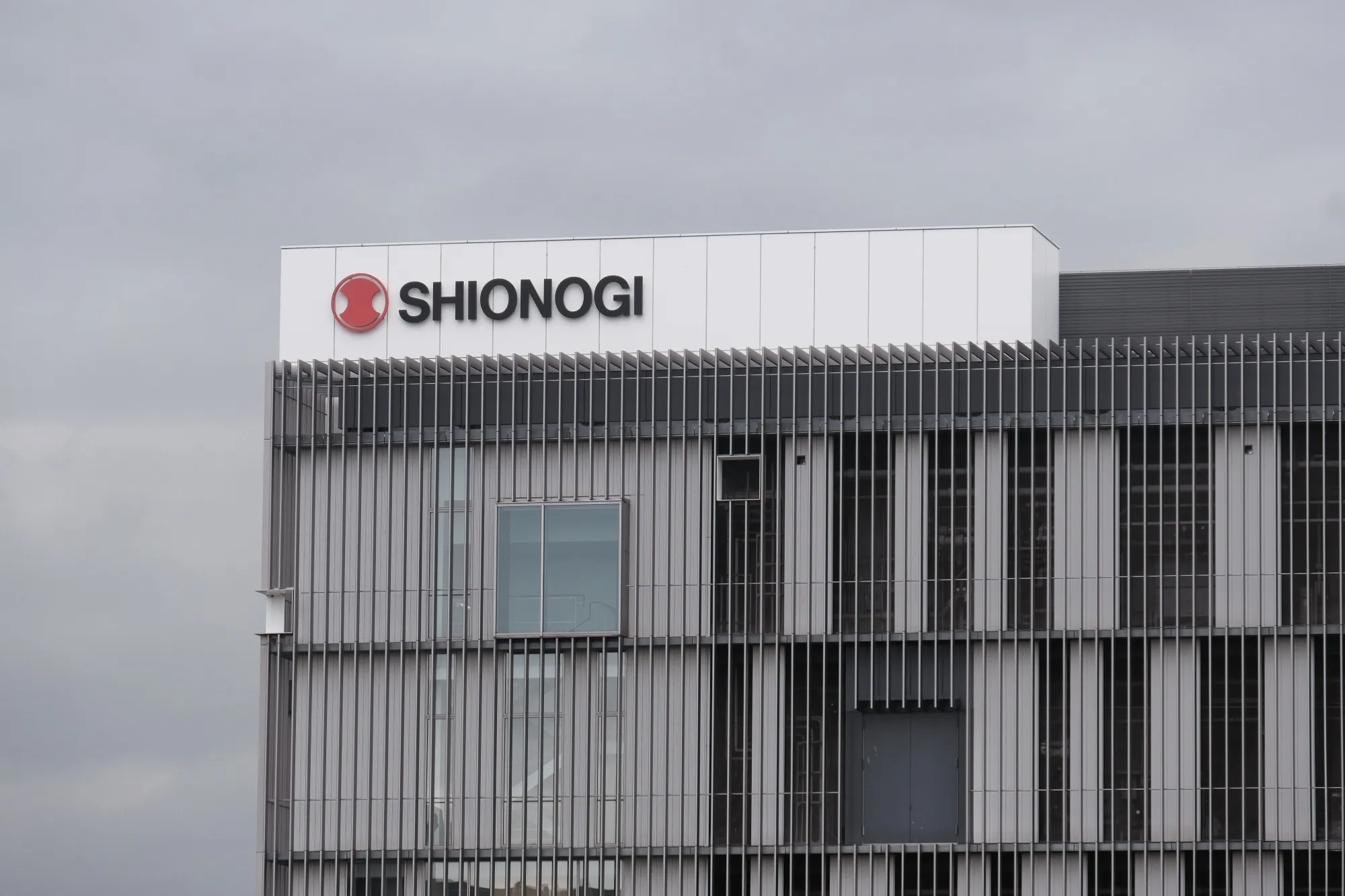 Signage of Shionogi &amp; Co. atop it's pharmaceutical research center in Toyoanaka, Osaka Prefecture, Japan.