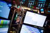 A trader works on the floor of the NYSE.