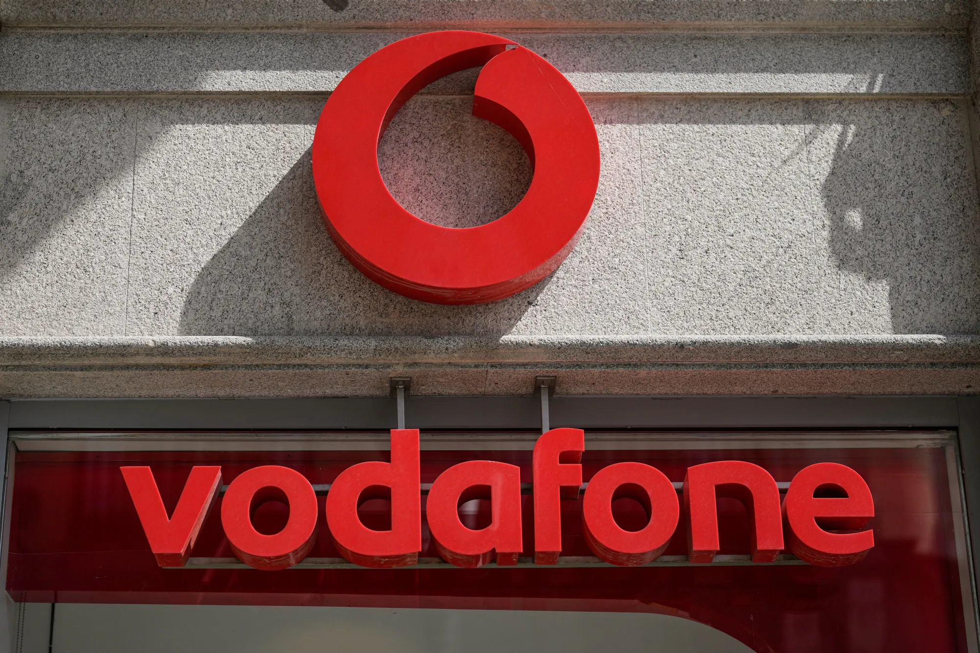 A sign above the entrance to a Vodafone store in Madrid, Spain.