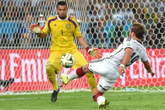 Mario Goetze of Germany scores a goal past Sergio Romero of Argentina in extra time during the 2014 FIFA World Cup Brazil Final