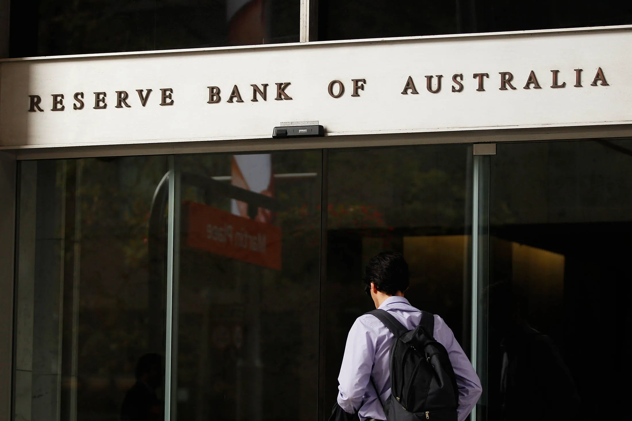 A man enters the Reserve Bank of Australia headquarters in Sydney, Australia, on Monday, Feb. 29, 2016. Australian wage rises are the smallest on record, jobs growth has evaporated and firms plan to cut investment. Add a stronger currency and global calls for stimulus and pressure is clearly building for interest-rate cuts.

