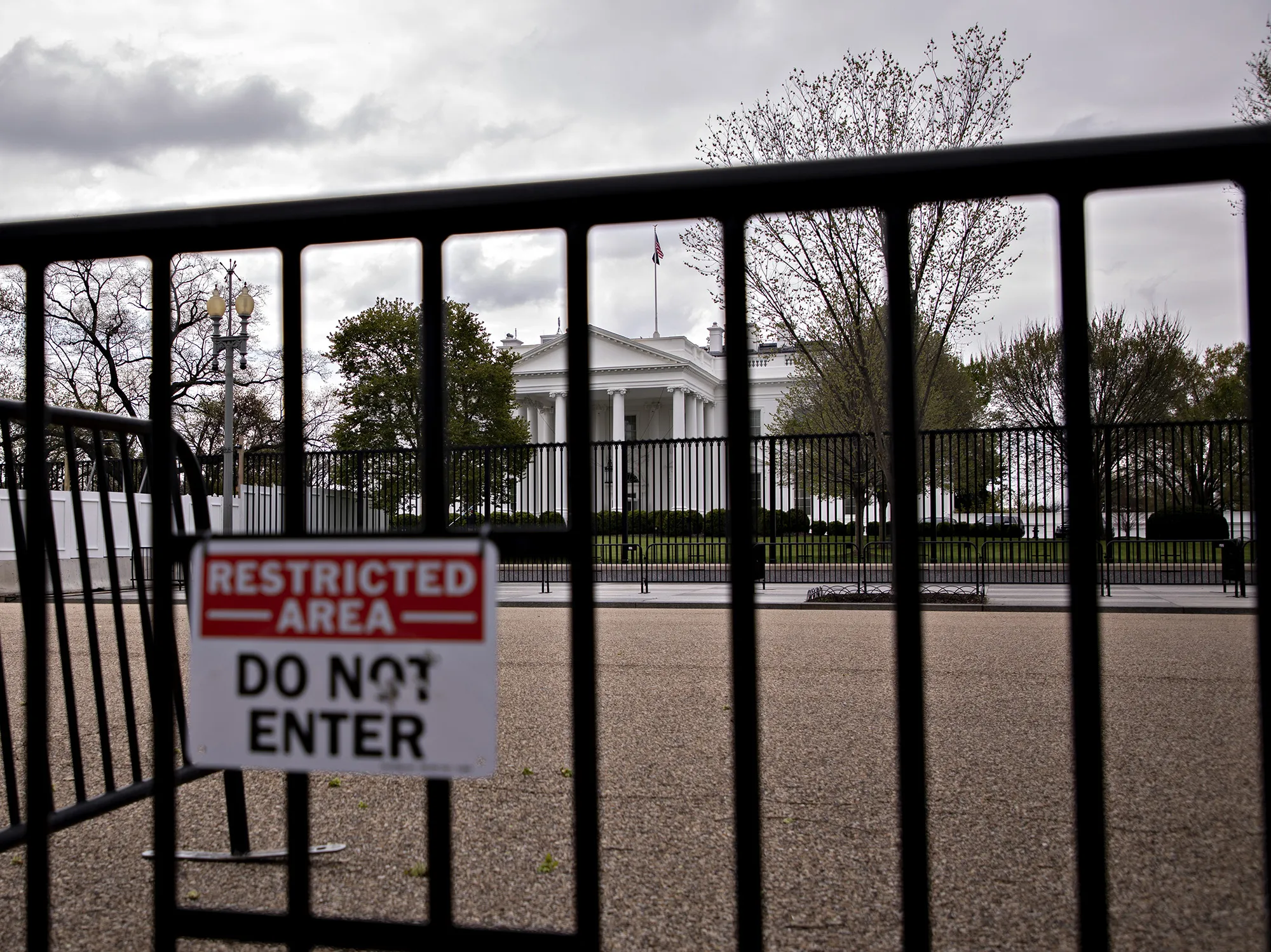 The White House stands past fencing in Washington, D.C. on&nbsp;April 1.