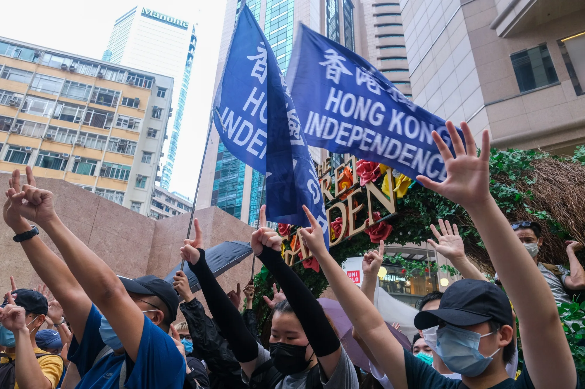 Protesters hold flags that read 'Hong Kong Independence' during a protest in Hong Kong on July 1.