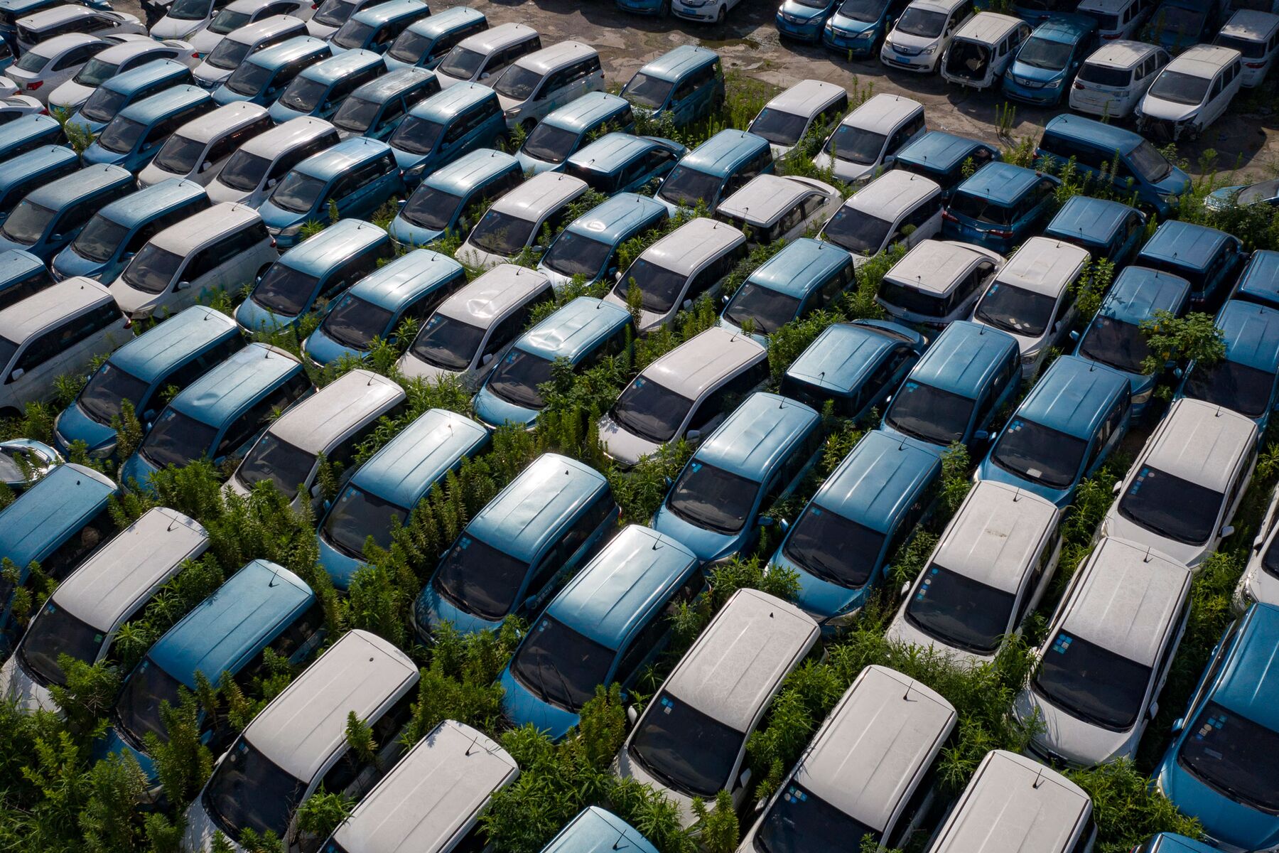 China’s Abandoned Electric Cars Pile Up After EV Boom Fueled by Subsidies