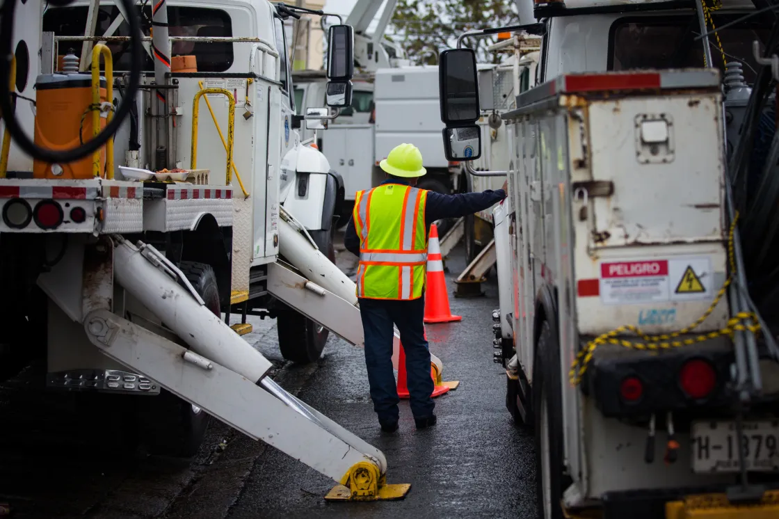 A Puerto Rico Electric Power Authority worker repairs electrical infrastructure in Canvanas on Oct. 10.