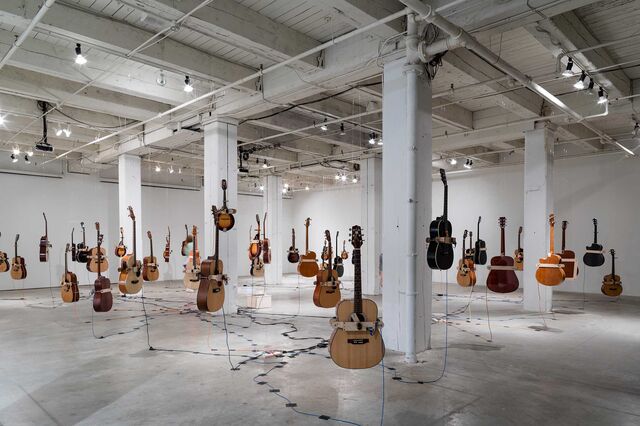 The installation of Charley Friedman's <i>Soundtracks for the Present Future</i> at Bemis Center for Contemporary Arts in Omaha. Friedman called Farritor the exhibition engineer.