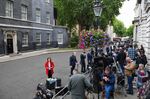 Members of the media report from outside 10 Downing Street, the day after the resignation of two of the most senior members of government, in London, UK, on July 6.