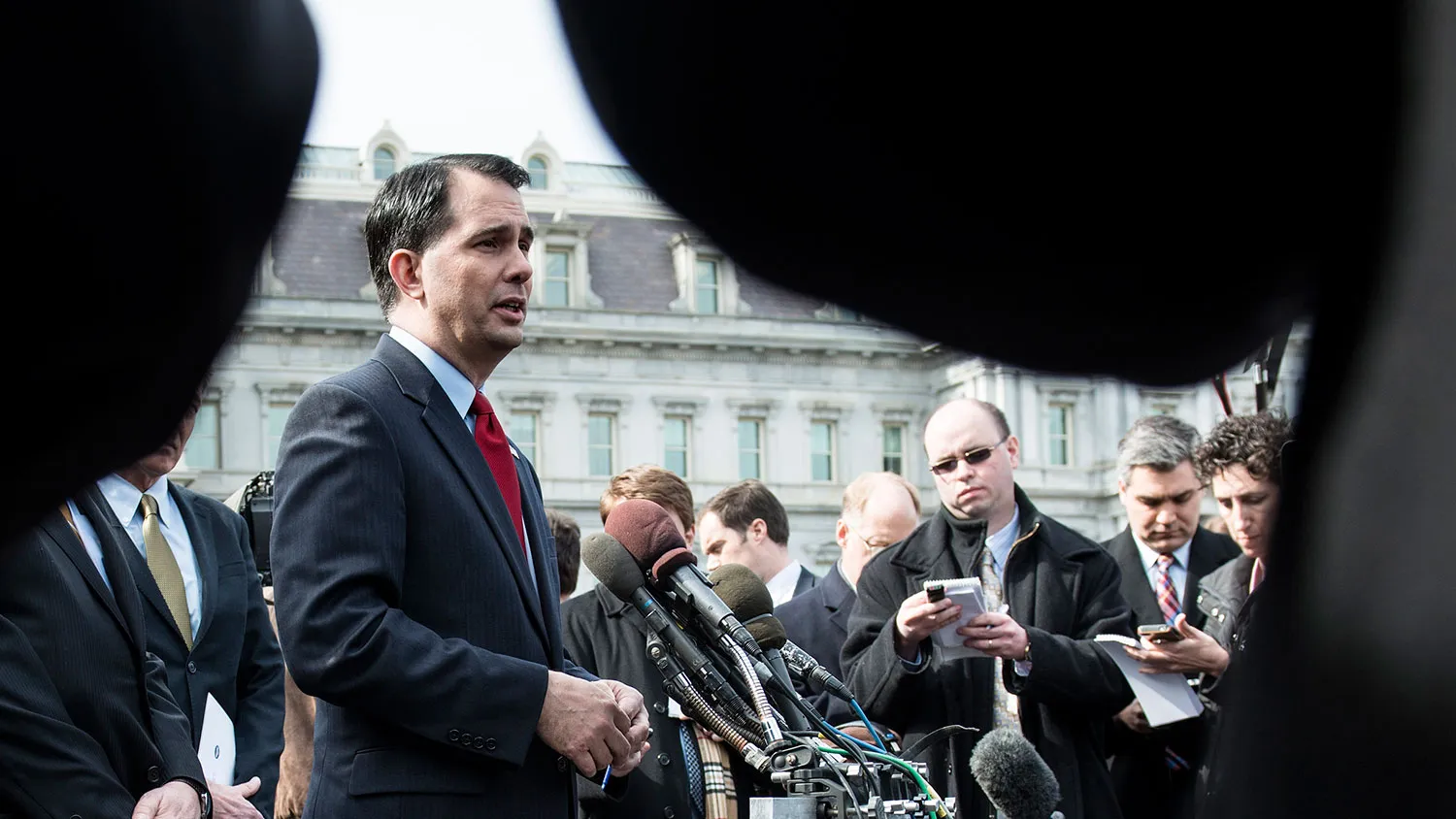 Wisconsin Governor Scott Walker speaking to reporters outside the White House after a luncheon February 25, 2013 in Washington, DC.
